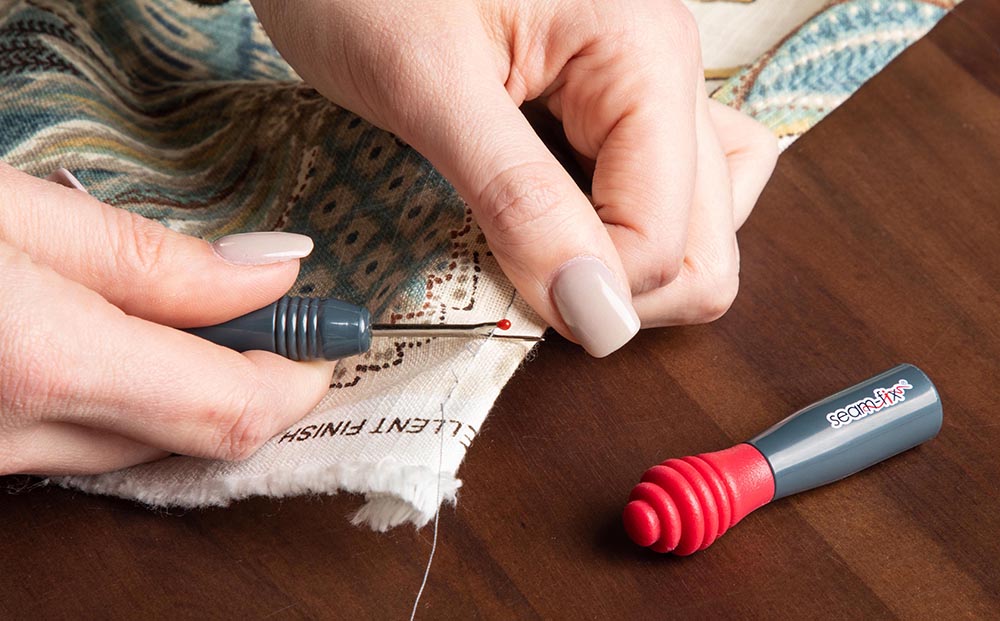 Easily undo sewing mistakes with a handheld seam ripper.